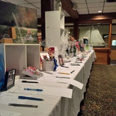 The table stretches on as bid sheets are laid out and ready for the silent battle at the Adopt a School Dinner at Captain's Galley in West Ocean City.