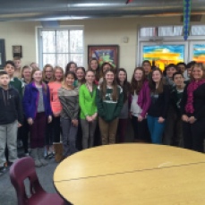 T'nia Falbo of BEACON at Salisbury University poses with her middle school class.