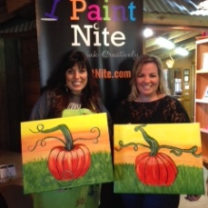 Two artists show off their creations at JAES' paint night.