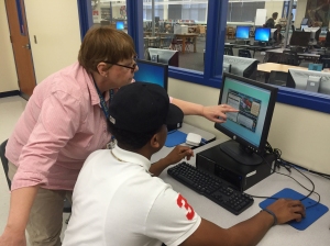 Wicomico High School Teacher, Debra Larson, helps a student assess his income and budget during the virtual portion of the Junior Achievement Finance Park program sponsored by the Salisbury Sunrise Rotary $10,000 grant 
